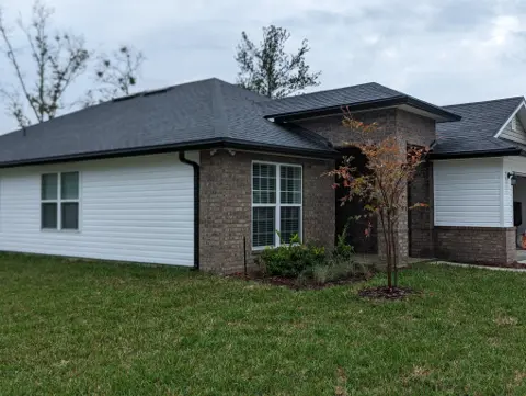Black Seamless Gutters — Jacksonville by Clean Gutter Protection