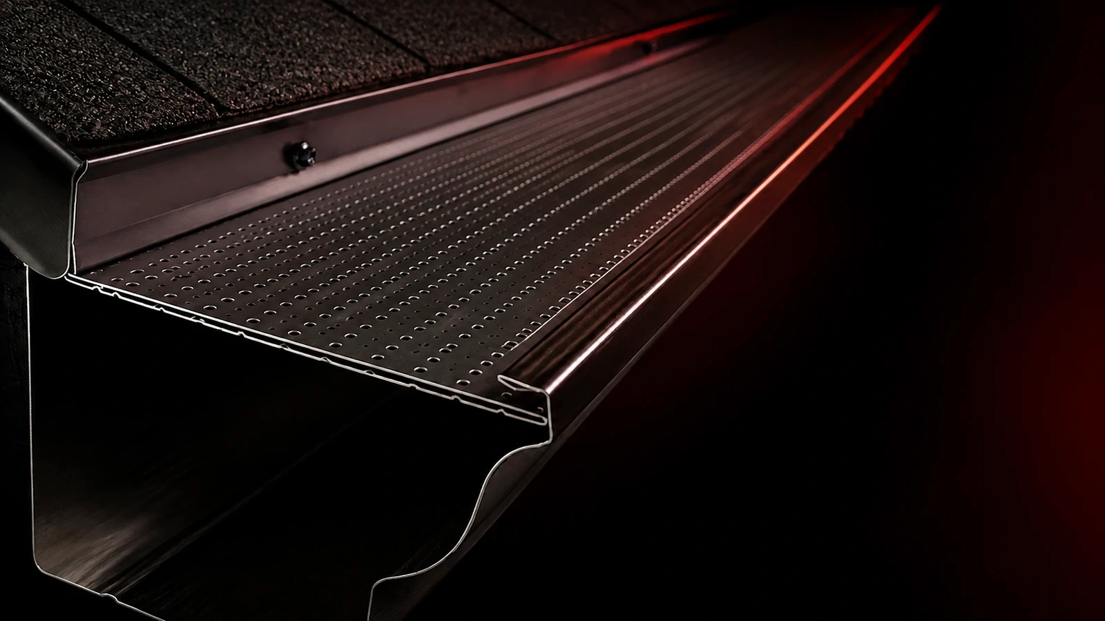 Illustrative close-up of Clean Gutter Protection's perforated aluminum guard and gutter cutaway